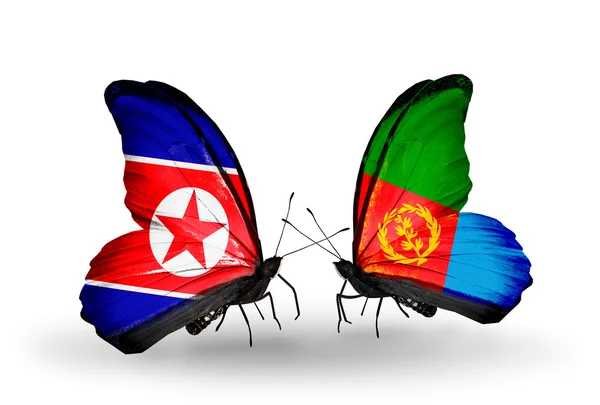 Borboletas com bandeiras da Coreia do Norte e Eritreia em asas — Fotografia de Stock