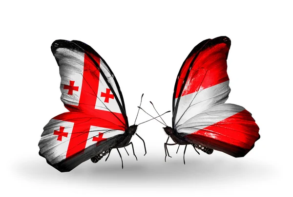 Butterflies with Georgia and Austria flags on wings — Stock Photo, Image