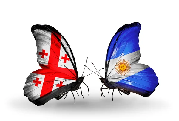 Schmetterlinge mit Georgia- und Argentinien-Flaggen auf Flügeln — Stockfoto