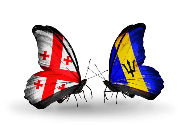 Butterflies with Georgia and Barbados flags on wings — Stock Photo, Image