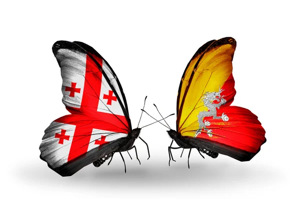 Butterflies with Georgia and Bhutan flags on wings — Stock Photo, Image