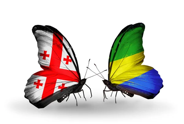 Papillons avec des drapeaux de Géorgie et du Gabon sur les ailes — Photo