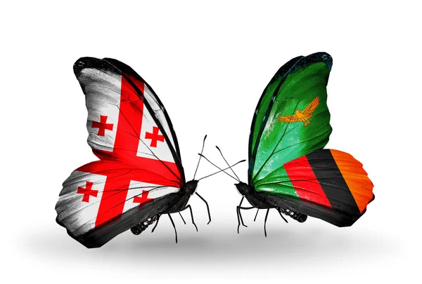 Mariposas con banderas de Georgia y Zambia en alas —  Fotos de Stock