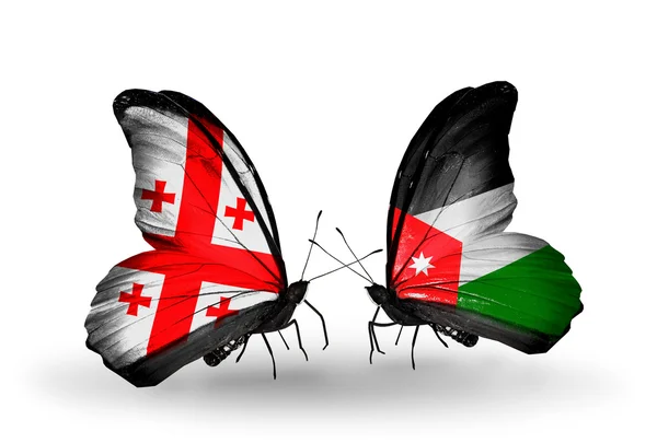 Farfalle con bandiere Georgia e Giordania sulle ali — Foto Stock
