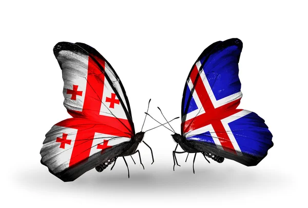 Butterflies with Georgia and Iceland islands flags on wings — Stock Photo, Image