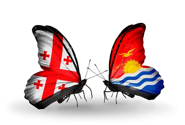 Borboletas com bandeiras das ilhas Geórgia e Kiribati em asas — Fotografia de Stock