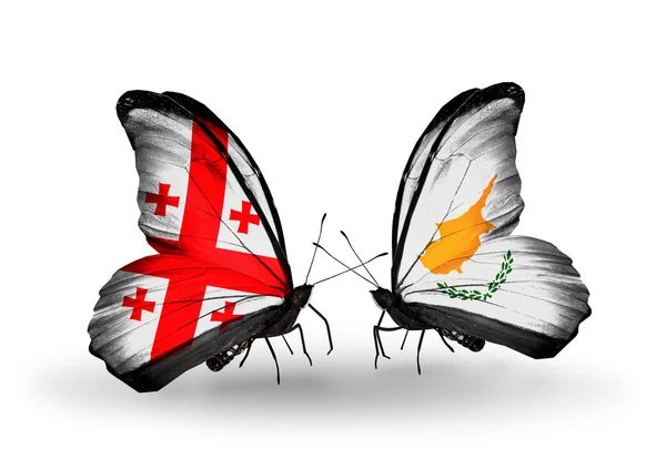 Butterflies with Georgia and Cyprus islands flags on wings — Stock Photo, Image