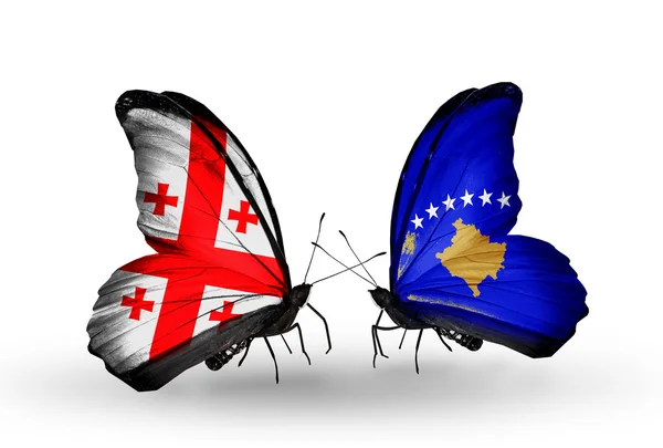 Butterflies with Georgia and Kosovo islands flags on wings — Stock Photo, Image