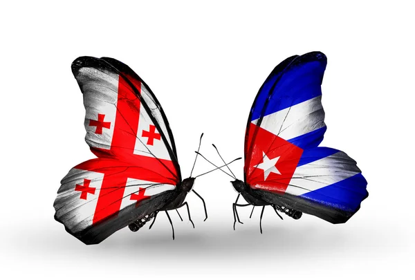 Butterflies with Georgia and Cuba islands flags on wings — Stock Photo, Image