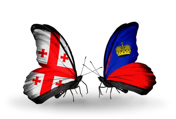 Butterflies with Georgia and Liechtenstein islands flags on wings — Stock Photo, Image