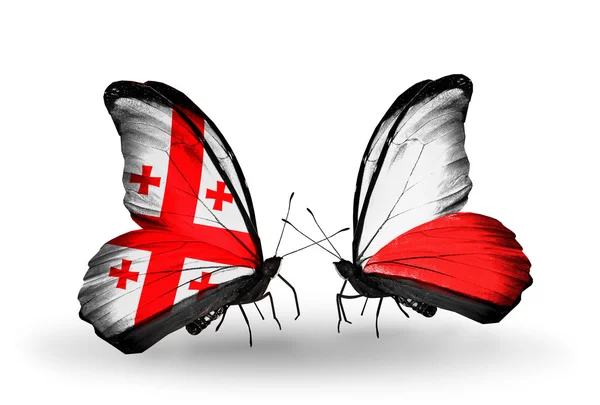 Butterflies with Georgia and Poland flags on wings — Stock Photo, Image