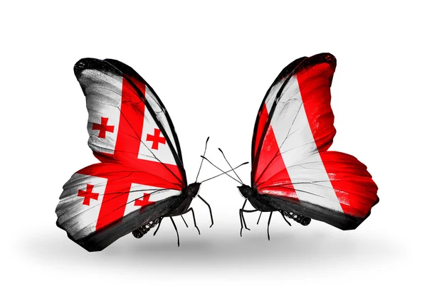 Farfalle con bandiere Georgia e Perù sulle ali — Foto Stock