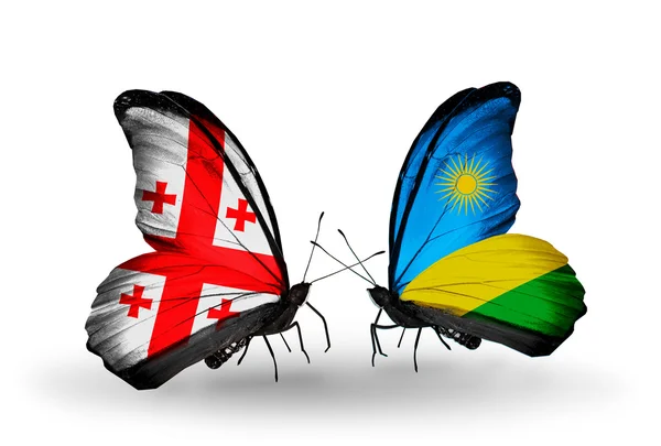 Papillons avec drapeaux Géorgie et Rwanda sur les ailes — Photo