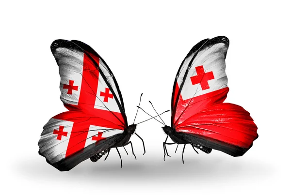 Butterflies with Georgia and Tonga flags on wings — Stock Photo, Image