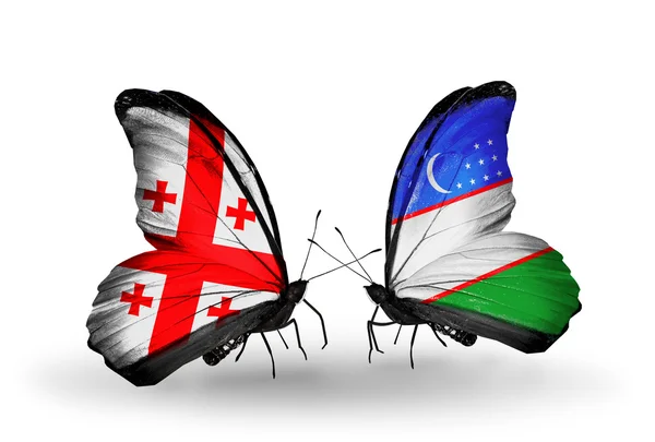 Mariposas con banderas de Georgia y Uzbekistán en alas —  Fotos de Stock
