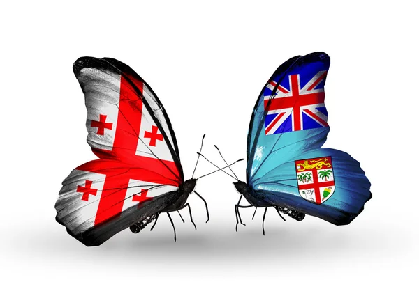 Borboletas com bandeiras da Geórgia e Fiji em asas — Fotografia de Stock