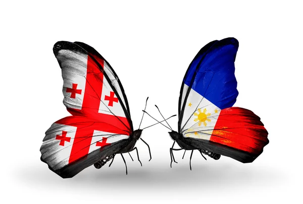 Butterflies with Georgia and Philippines flags on wings — Stock Photo, Image
