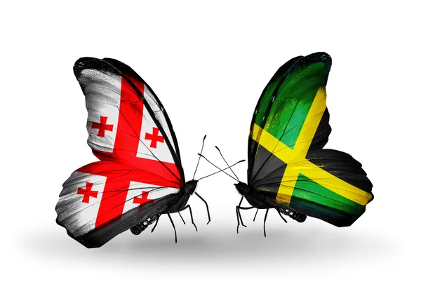 Butterflies with Georgia and Jamaica flags on wings — Stock Photo, Image