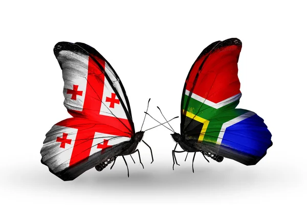 Papillons avec des drapeaux de Géorgie et d'Afrique du Sud sur les ailes — Photo