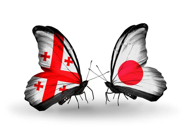 Бабочки с флагами Грузии и Японии на крыльях — стоковое фото