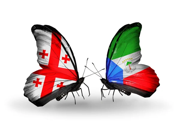 Fjärilar med Georgien och Ekvatorialguinea flaggor på vingar — Stockfoto