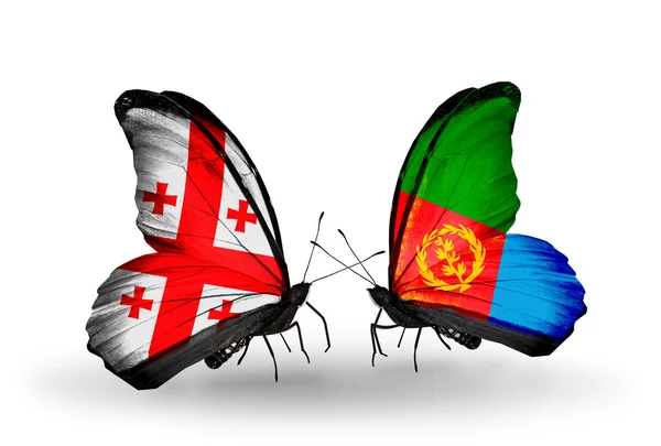 Butterflies with Georgia and Eritrea flags on wings — Stock Photo, Image