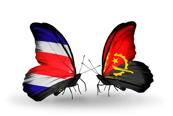 Papillons avec des drapeaux du Costa Rica et d'Angola sur les ailes — Photo