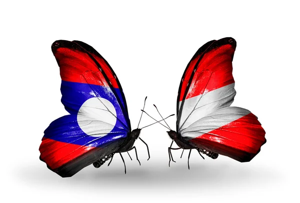 Butterflies with Laos and Austria flags on wings — Stock Photo, Image