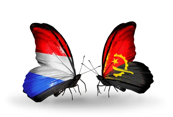 Borboletas com bandeiras do Luxemburgo e de Angola nas asas — Fotografia de Stock