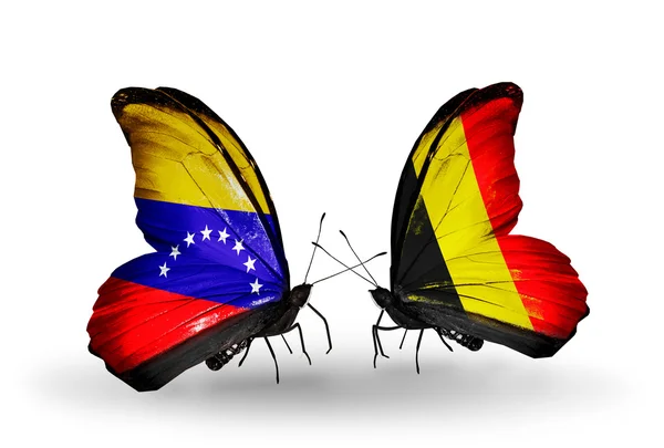 Schmetterlinge mit Venezuela und belgischen Flaggen auf Flügeln — Stockfoto
