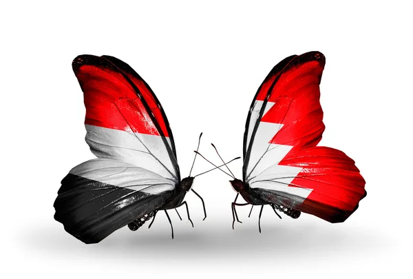 Borboletas com bandeiras do Iêmen e do Bahrein em asas — Fotografia de Stock
