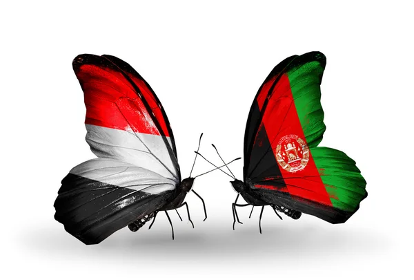 Farfalle con bandiere Yemen e Afghanistan sulle ali — Foto Stock