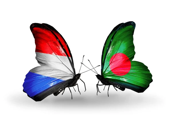 Motyle z flagi Luksemburga i Bangladeszu na skrzydłach — Zdjęcie stockowe