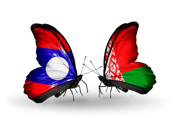 Fjärilar med laos och Vitryssland flaggor på vingar — Stockfoto