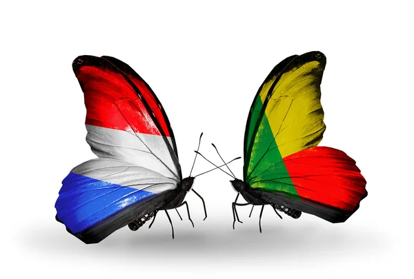 Butterflies with Luxembourg and Benin flags on wings — Stock Photo, Image