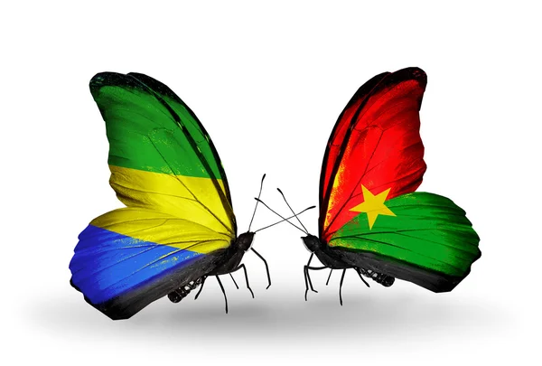 Papillons avec drapeaux Gabon et Burkina Faso sur les ailes — Photo