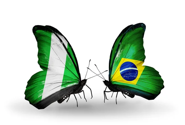 Fjärilar med nigeria och Brasilien flaggor på vingar — Stockfoto