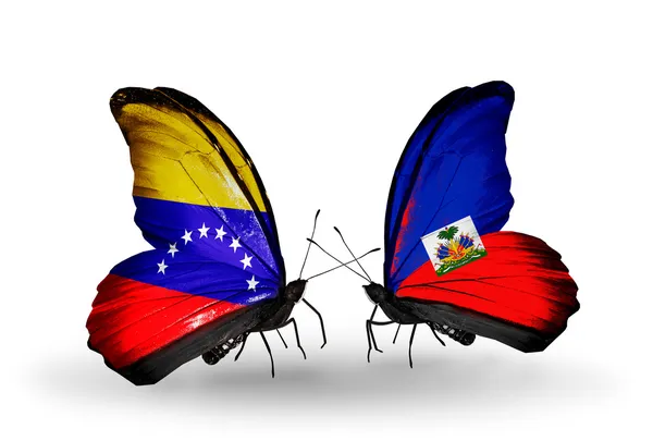 Papillons avec drapeaux Venezuela et Haïti sur les ailes — Photo