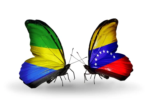 Farfalle con bandiere Gabon e Venezuela sulle ali — Foto Stock