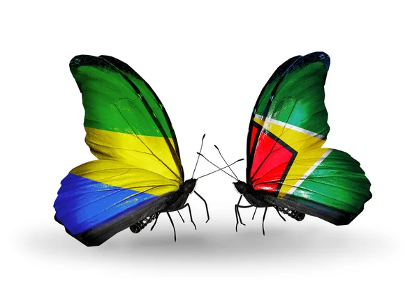 Butterflies with Gabon and  Guyana flags on wings — Stock Photo, Image