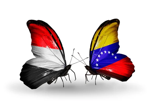 Schmetterlinge mit Jemen und Venezuela-Flaggen auf Flügeln — Stockfoto