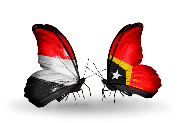 Mariposas con banderas de Yemen y Timor Oriental en alas —  Fotos de Stock
