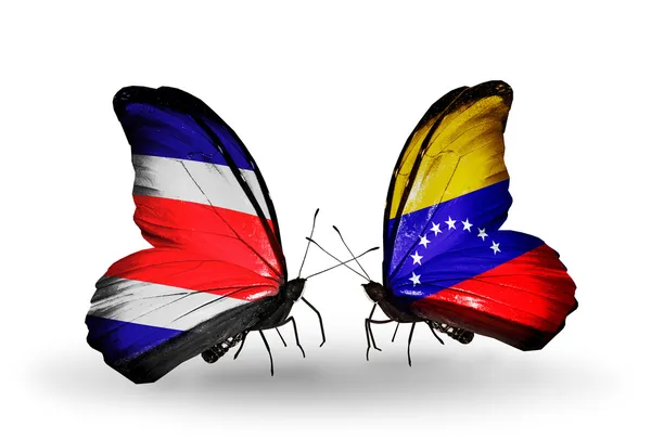 Farfalle con bandiere Costa Rica e Venezuela sulle ali — Foto Stock