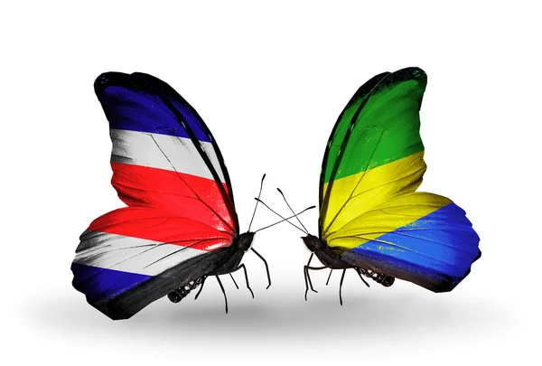 Butterflies with Costa Rica and Gabon flags on wings — Stock Photo, Image