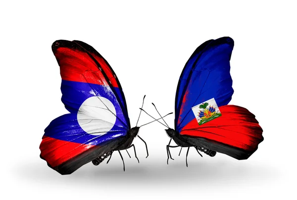 Papillons avec drapeaux Laos et Haïti sur les ailes — Photo