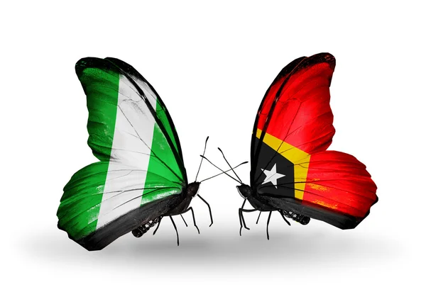 Butterflies with Nigeria and East Timor flags on wings — Stock Photo, Image