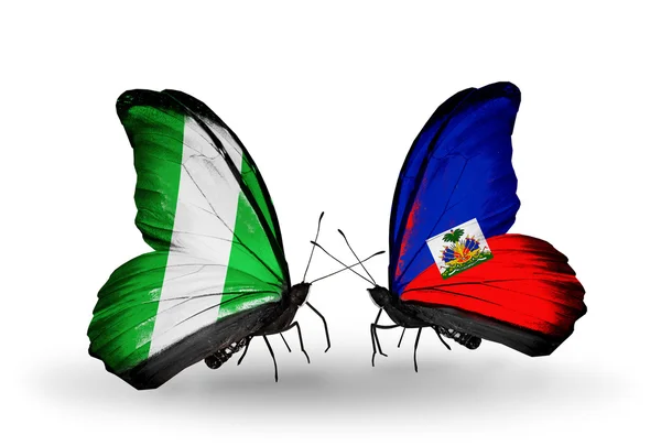 Butterflies with Nigeria and Haiti flags on wings — Stock Photo, Image