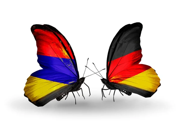 Borboletas com bandeiras da Armênia e da Alemanha em asas — Fotografia de Stock