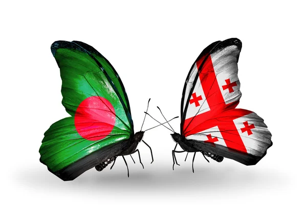 Fjärilar med bangladesh och Georgien flaggor på vingar — Stockfoto