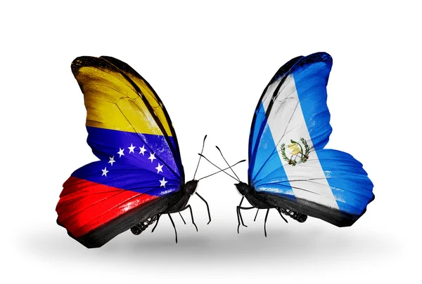 Schmetterlinge mit Venezuela- und Guatemala-Flaggen auf Flügeln — Stockfoto